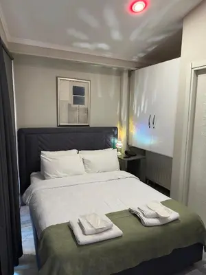 a bedroom with a bed with two towels on it at Chez Bore in Istanbul