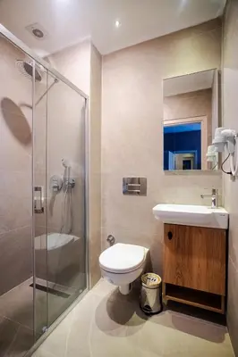 a bathroom with a toilet and a sink and a shower at Cheers Porthouse in Istanbul