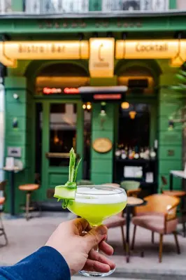 a person holding a margarita with a green drink at Cheers Porthouse in Istanbul