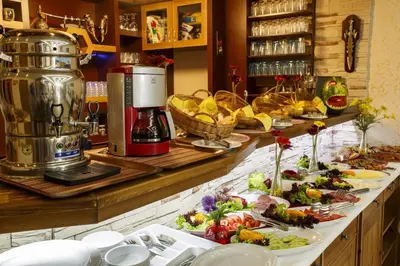 a buffet with many plates of food on a counter at Hotel Ipekyolu in Istanbul
