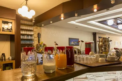 a bar with glasses of drinks on a counter at Hotel Ipekyolu in Istanbul