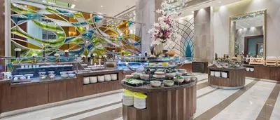 a lobby of a hotel with a dessert bar at Hilton Bursa Convention Center & Spa in Bursa