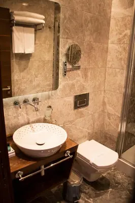 a bathroom with a sink and a toilet at Old Port Hotel in Istanbul