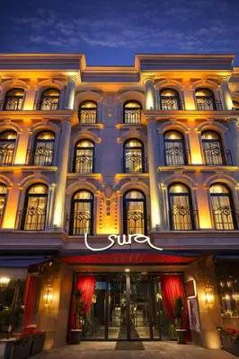 a building with a sun sign on the front of it at Sura Design Hotel & Suites in Istanbul