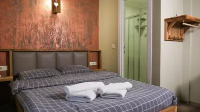 a bedroom with a bed with towels on it at Second Home Suites in Istanbul