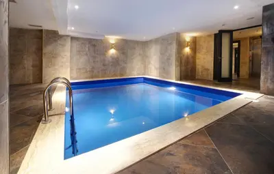 a large swimming pool in a room with at Concept Nisantasi Hotels & Spa in Istanbul