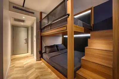 a bedroom with a bunk bed and a staircase at Concept Nisantasi Hotels & Spa in Istanbul