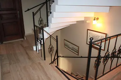 a staircase in a home with black railings at Hotel SultanHill in Istanbul