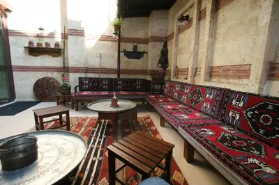 a living room with couches and tables in a building at Hotel SultanHill in Istanbul