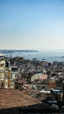 a city with buildings and the ocean in the background at Maroon Tomtom in Istanbul