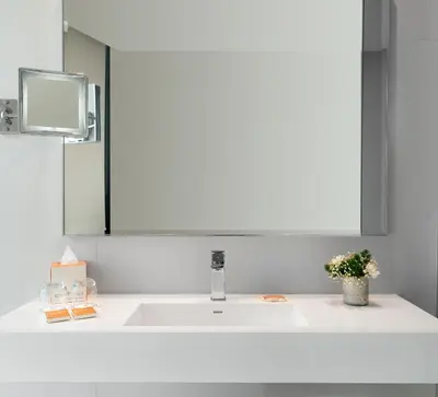 a bathroom with a white sink and a mirror at Centro Westside by Rotana in Istanbul