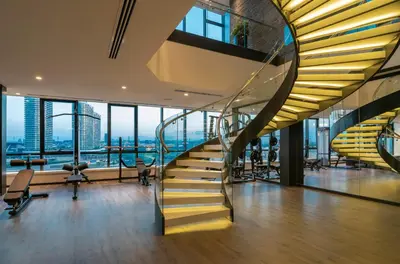 a spiral staircase in a building with a view at WestSide Residences by Rotana in Istanbul