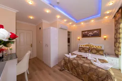 a bedroom with a bed and a table in a room at Charm Hotel in Istanbul