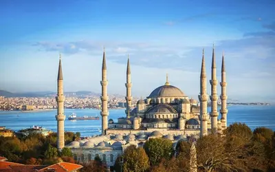 a large building with many domes and mosques at Charm Hotel in Istanbul