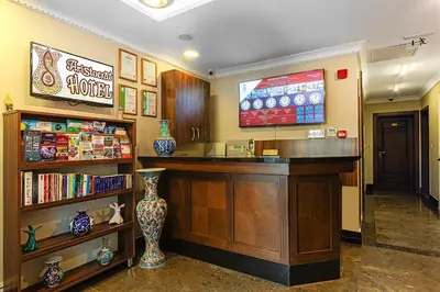 a hotel lobby with a reception desk and a tv at Aristocrat Hotel in Istanbul