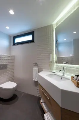 a bathroom with a sink and a toilet and a mirror at Riva's Moda in Istanbul