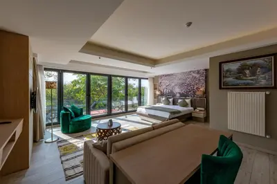 a living room with a couch and a bed at Riva's Moda in Istanbul