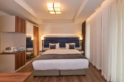 a bedroom with a large bed in a room at Golden Royal Hotel & SPA in Istanbul