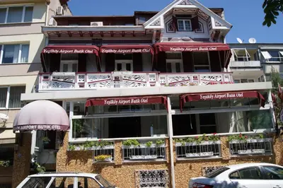 a building with cars parked in front of it at Yeşilköy Airport Hotel in Istanbul