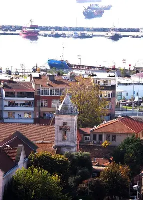 a clock tower on top of a city with a harbor at Grand Emir Hotel Old City in Istanbul