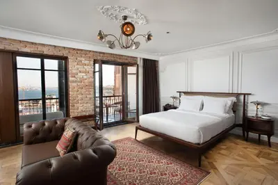 a bedroom with a bed and a couch at Georges Hotel Galata in Istanbul