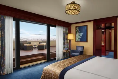 a bedroom with a bed and a view of a balcony at Divan Istanbul in Istanbul
