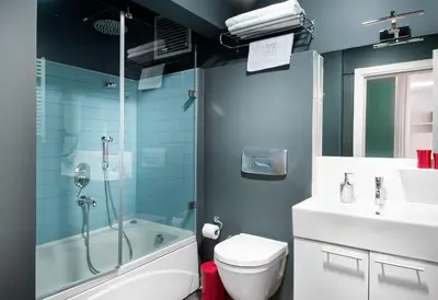 a bathroom with a toilet and a tub and a sink at Nuru Ziya Residences in Istanbul