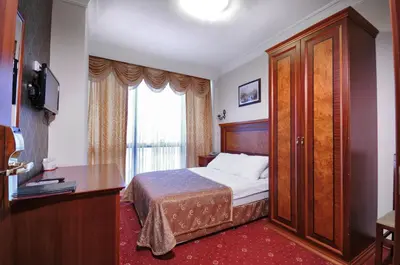 a hotel room with a bed and a window at Grand Eyuboglu Hotel in Istanbul