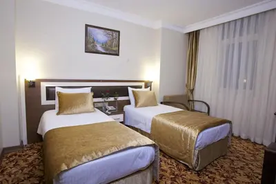 a hotel room with two beds in a room at Grand Anatolia Hotel in Istanbul
