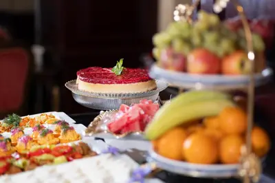 a table topped with different types of fruits and cakes at Balin Hotel - Special Category in Istanbul