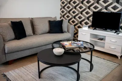 a living room with a couch and a coffee table at 12 rooms hotel in Köseilyas