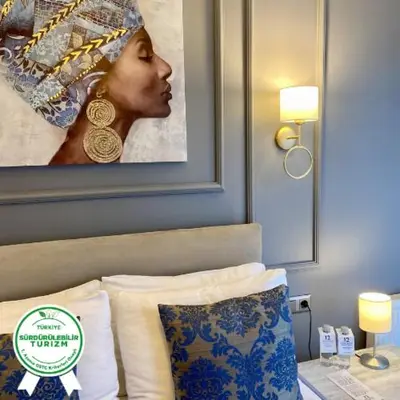 a portrait of a woman in a hotel room at 12 rooms hotel in Köseilyas
