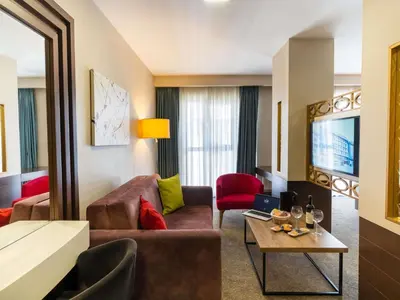 a living room with a couch and a table at ibis Styles Istanbul Bomonti in Istanbul