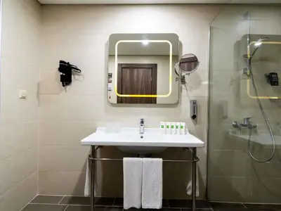 a bathroom with a sink and a shower at ibis Styles Istanbul Bomonti in Istanbul