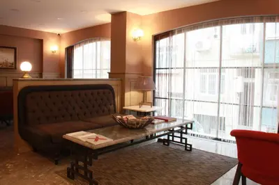 a living room with a couch and a table at Endless Comfort Hotel Taksim in Istanbul