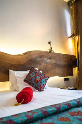 a bed with two pillows on top of it at West Pera Hotel in Istanbul