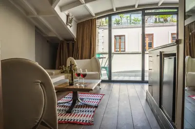 a room with chairs and a table with wine glasses at West Pera Hotel in Istanbul