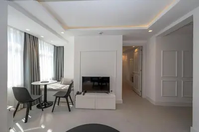 a living room with a television and a table at Juno Hotel Taksim in Istanbul