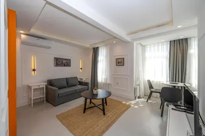 a living room with a couch and a table at Juno Hotel Taksim in Istanbul