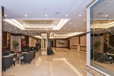 a lobby of a hotel with chairs and tables at Piya Sport Hotel in Istanbul