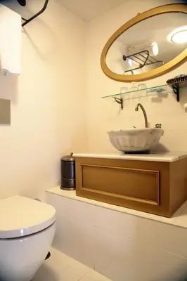 a bathroom with a sink and a toilet at Merial Hotel Sultanahmet in Istanbul