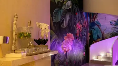 a room with a purple wall with flowers and candles at Dosso Dossi Hotels & SPA Golden Horn in Istanbul