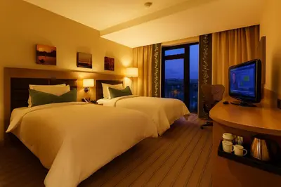 a hotel room with two beds and a television at Dosso Dossi Hotels & SPA Golden Horn in Istanbul