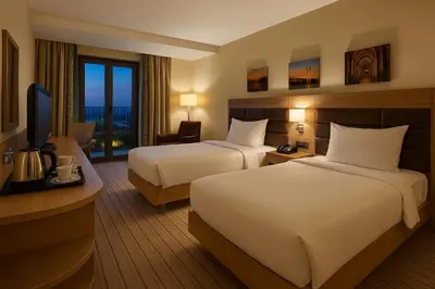 a hotel room with two beds and a television at Dosso Dossi Hotels & SPA Golden Horn in Istanbul