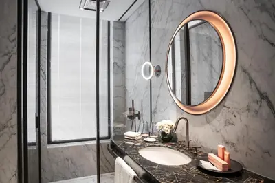 a bathroom with a sink and a mirror at Glens Palas Istanbul Nisantasi in Istanbul
