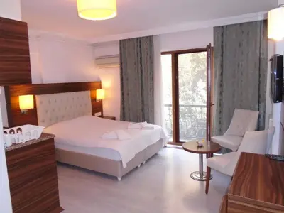 a hotel room with a bed and a window at City House in Istanbul