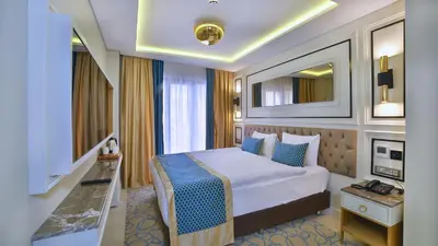 a hotel room with a bed and a television at Beethoven Premium Hotel in Istanbul