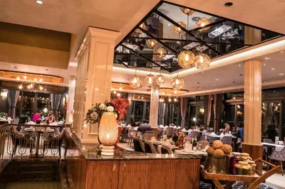 a restaurant with a dining room with tables and chairs at Beethoven Premium Hotel in Istanbul