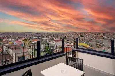 a view of a city from a balcony with a table at Faros Hotel Taksim-Special Category in Istanbul