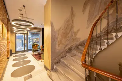 a hallway with a staircase in a building with a stair case at Premist Hotels Taksim in Istanbul
